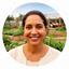 Maria Gonzales smiling outdoors at a community garden